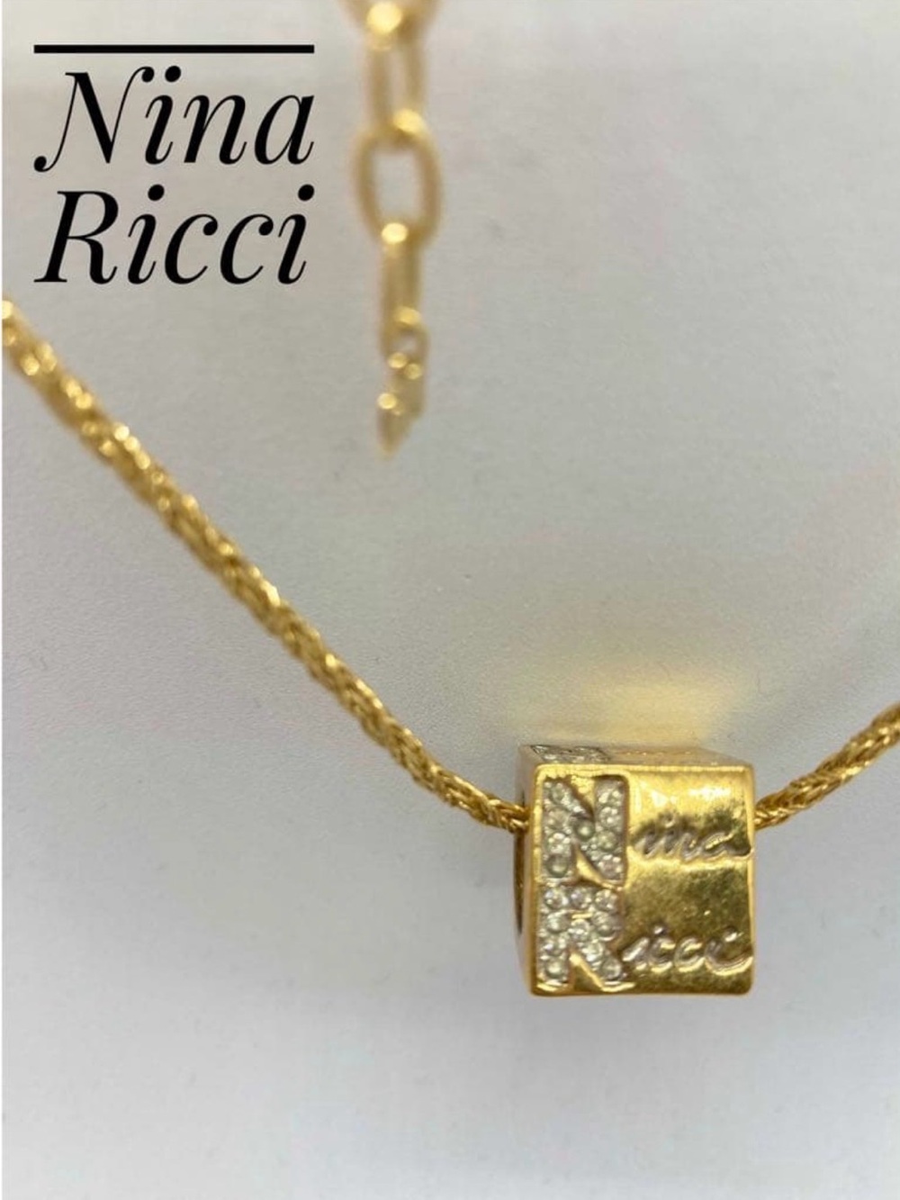 Nina Ricci Gold Cube Pendant Necklace with Crystal Accents